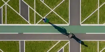 Unlocking Tomorrow: Key Marketing Trends for Modern Workforce Engagement Aerial view of a person navigating a geometrically patterned urban park pathway, symbolizing complex talent marketing strategies for modern workforce engagement.