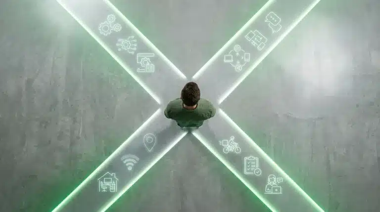 An overhead view of a person standing on glowing digital pathways, symbolizing the convergence of automation, remote work, and the gig economy in the evolving workforce.